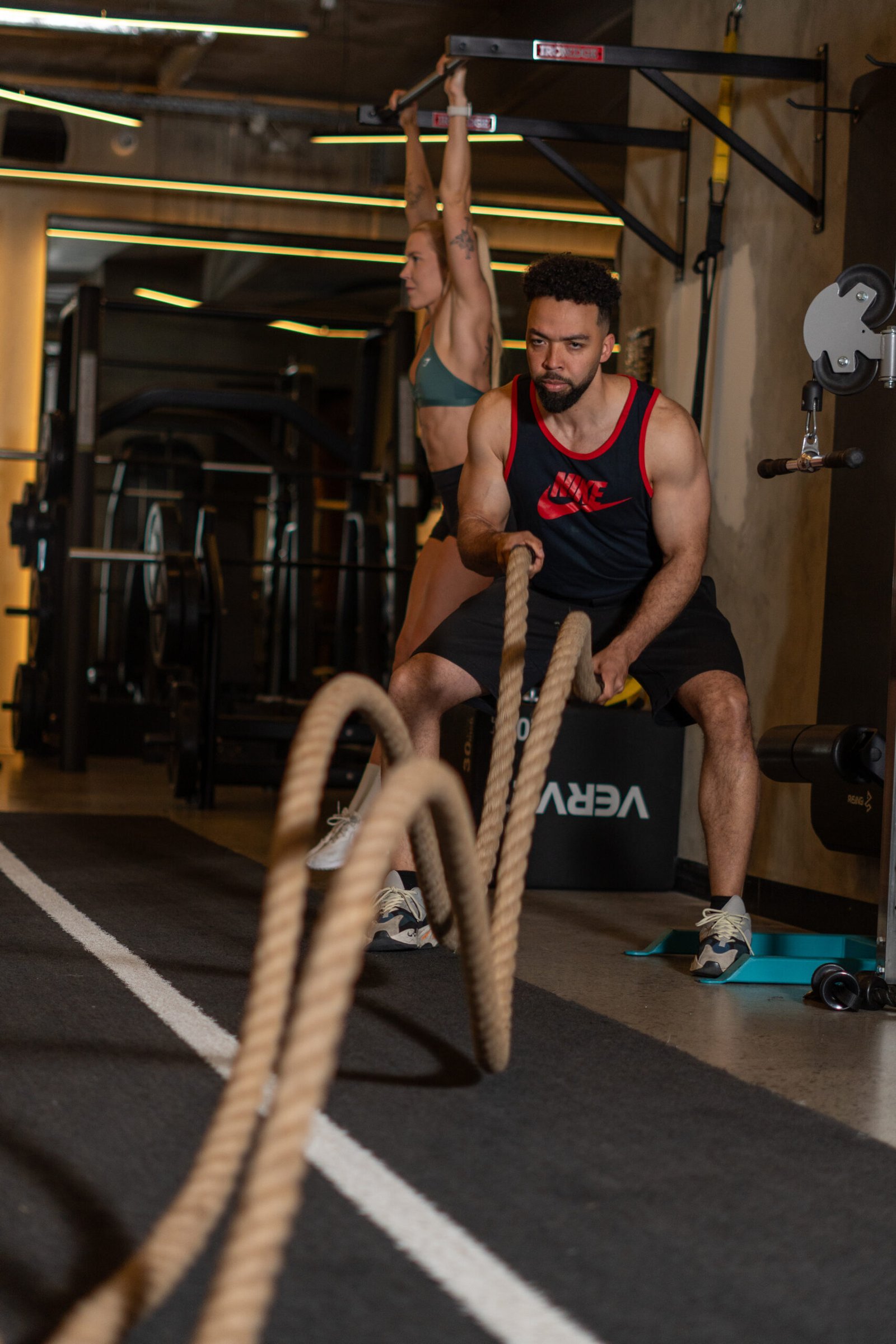 Trainer using battle rope with Anthony Nitti at Cremorne Club